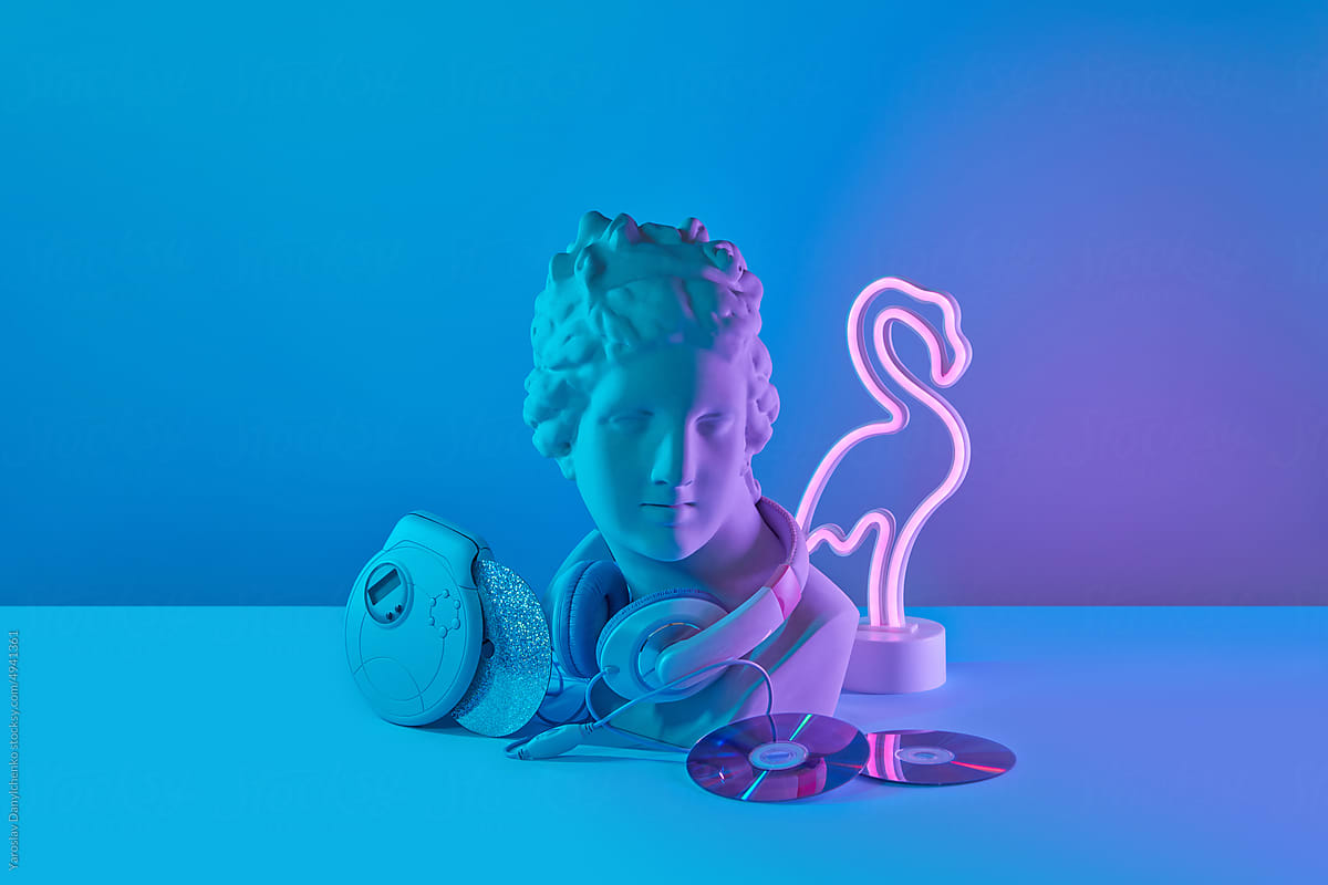 Bust with headphones, player and flamingo lamp.