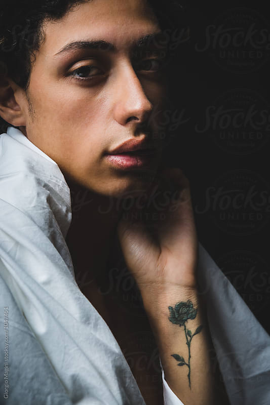 Dark Portrait of a Teen with a Rose Tattoo