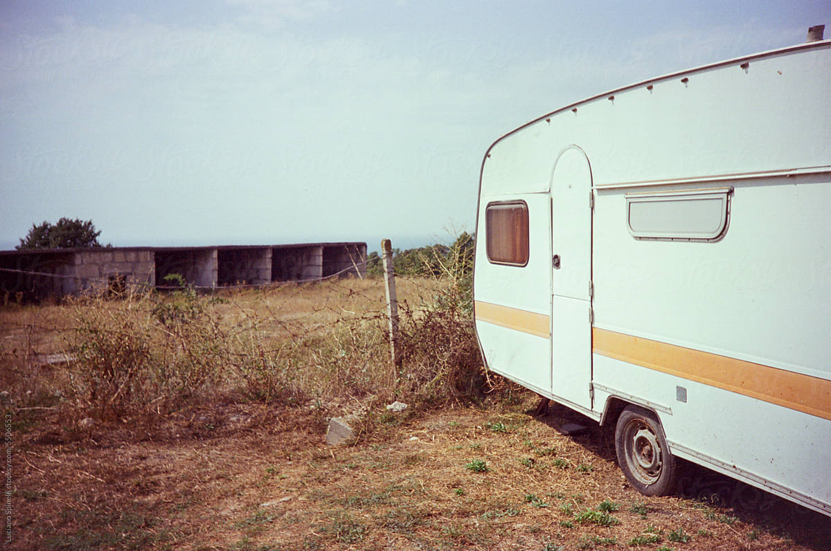 Vintage caravan parked during summer vacation: image with copy space