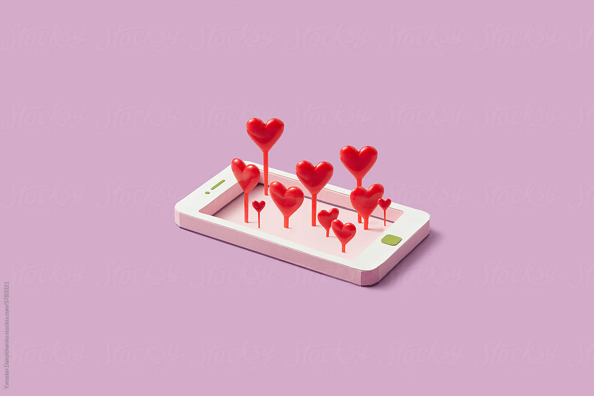 Red hearts sticking out paper made smartphone frame