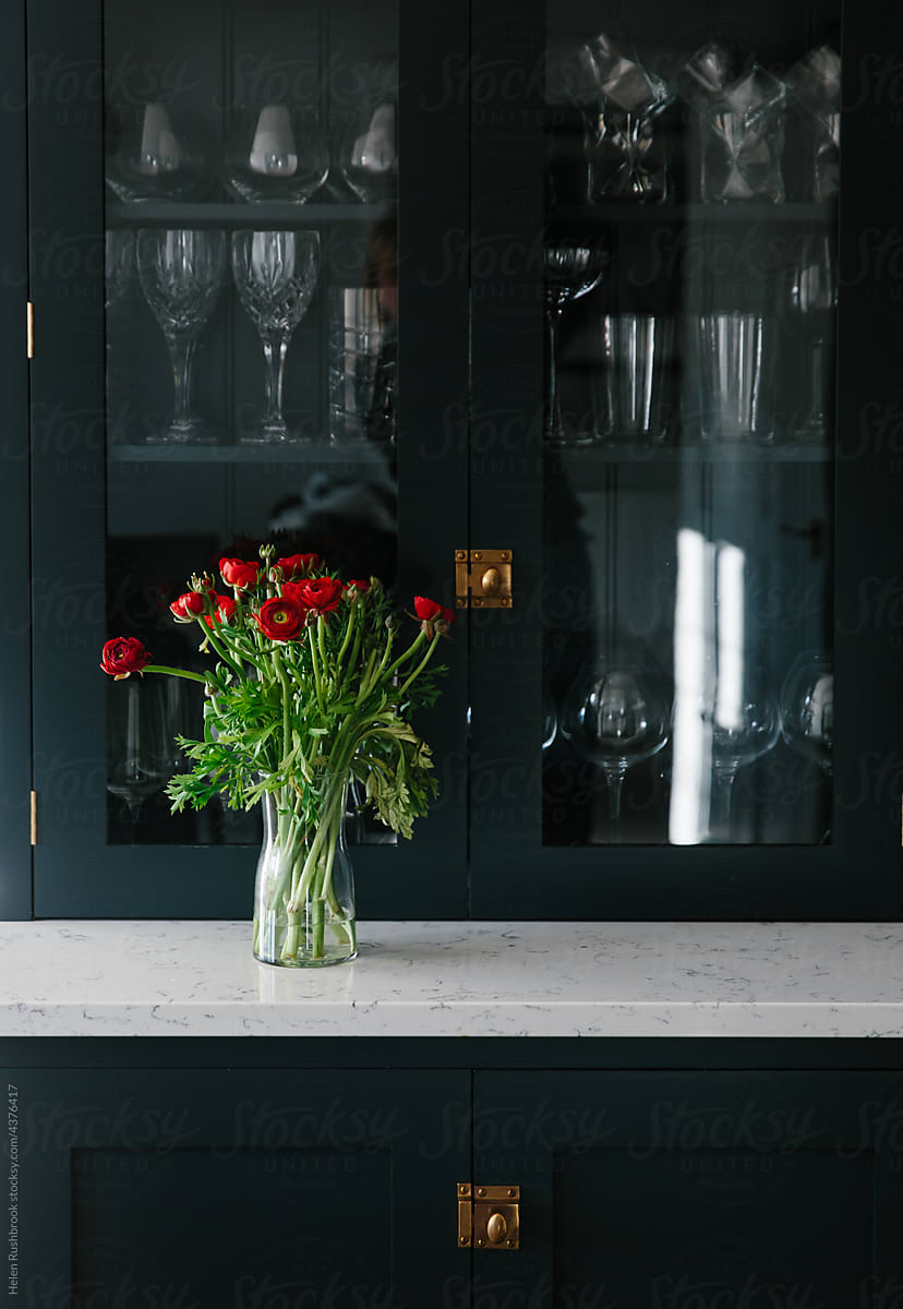 Red flowers on kitchen dresser