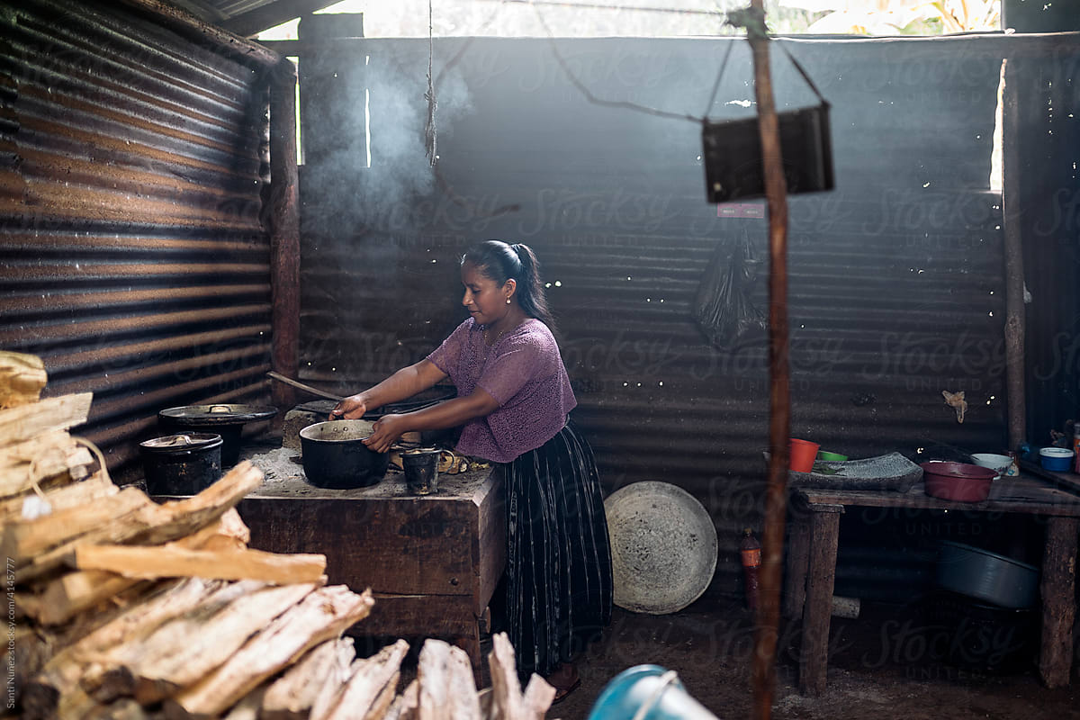 Young guatemalan woman preparing traditional food