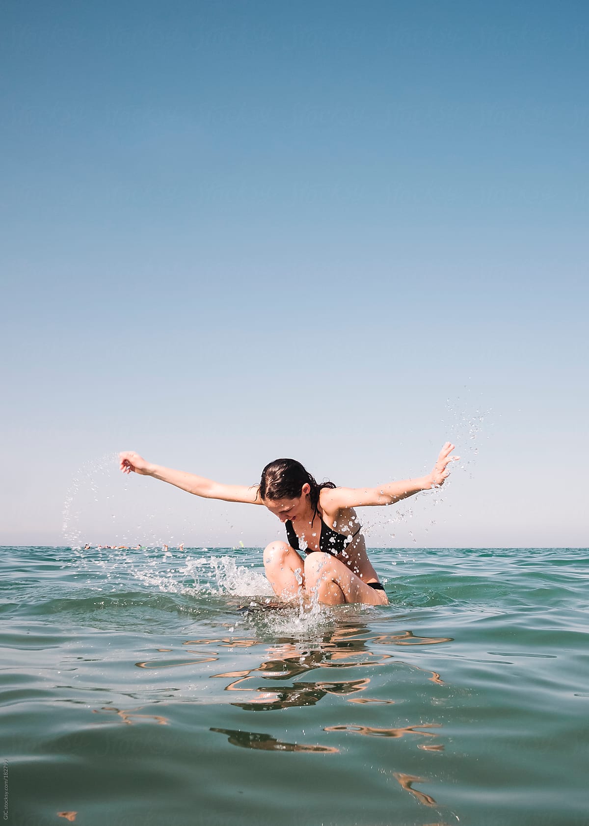 Couple Having Fun In The Sea By Stocksy Contributor Simone Wave Stocksy 