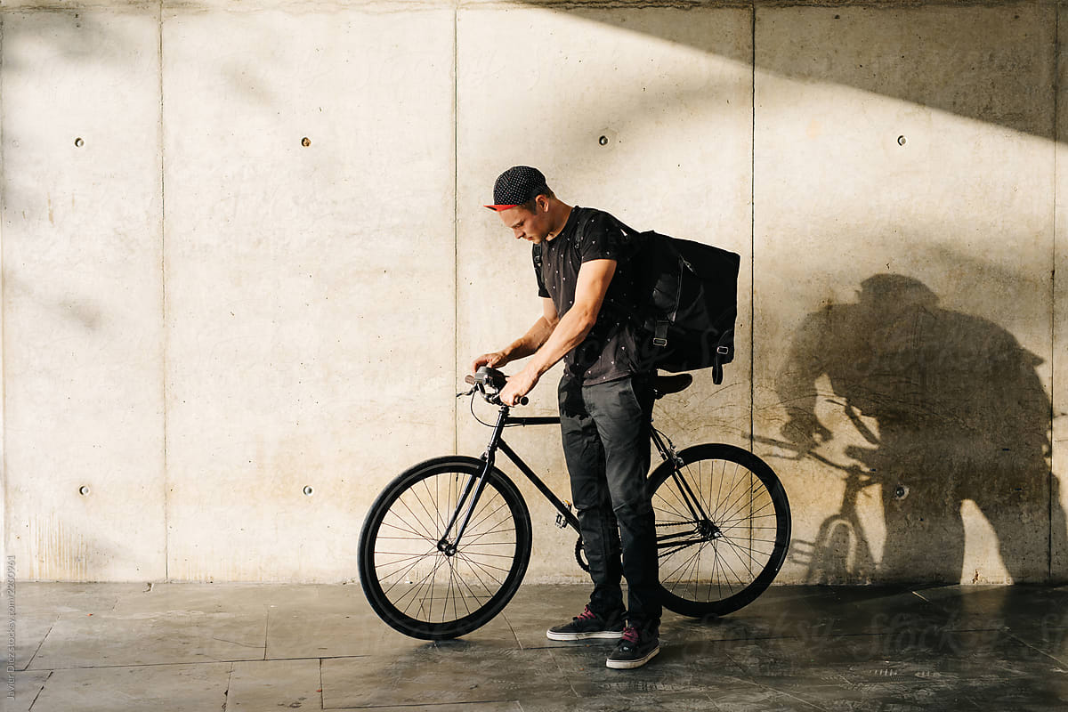 Man with delivery bag and bicycle