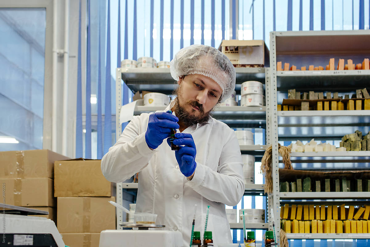 Cosmetic chemist creating products in laboratory