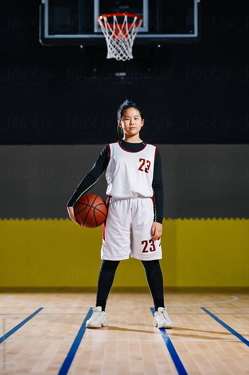 Portrait of basketball girl smiling in a gym