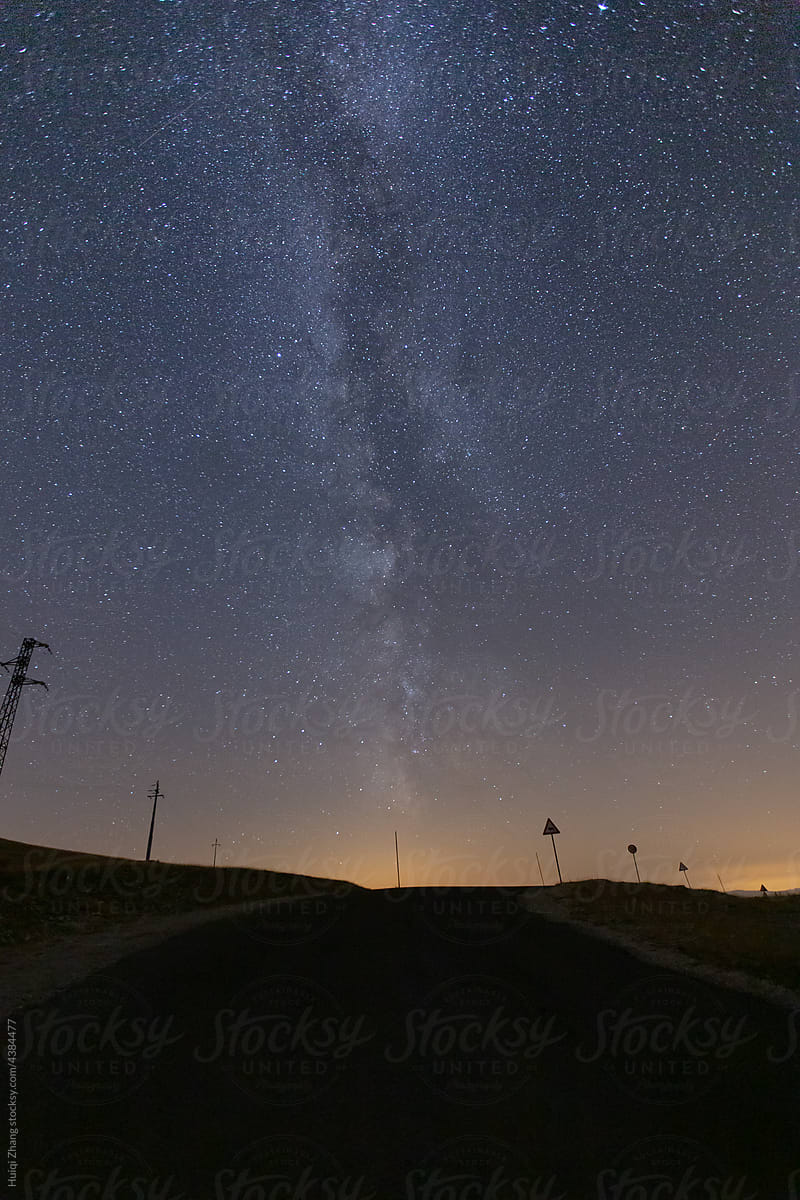 Starry sky and Milky Way on the summer road