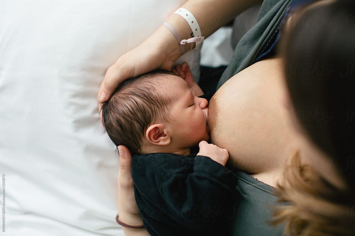 Mom Breast Feeding Her Newborn Baby Boy By Bonninstudio Baby