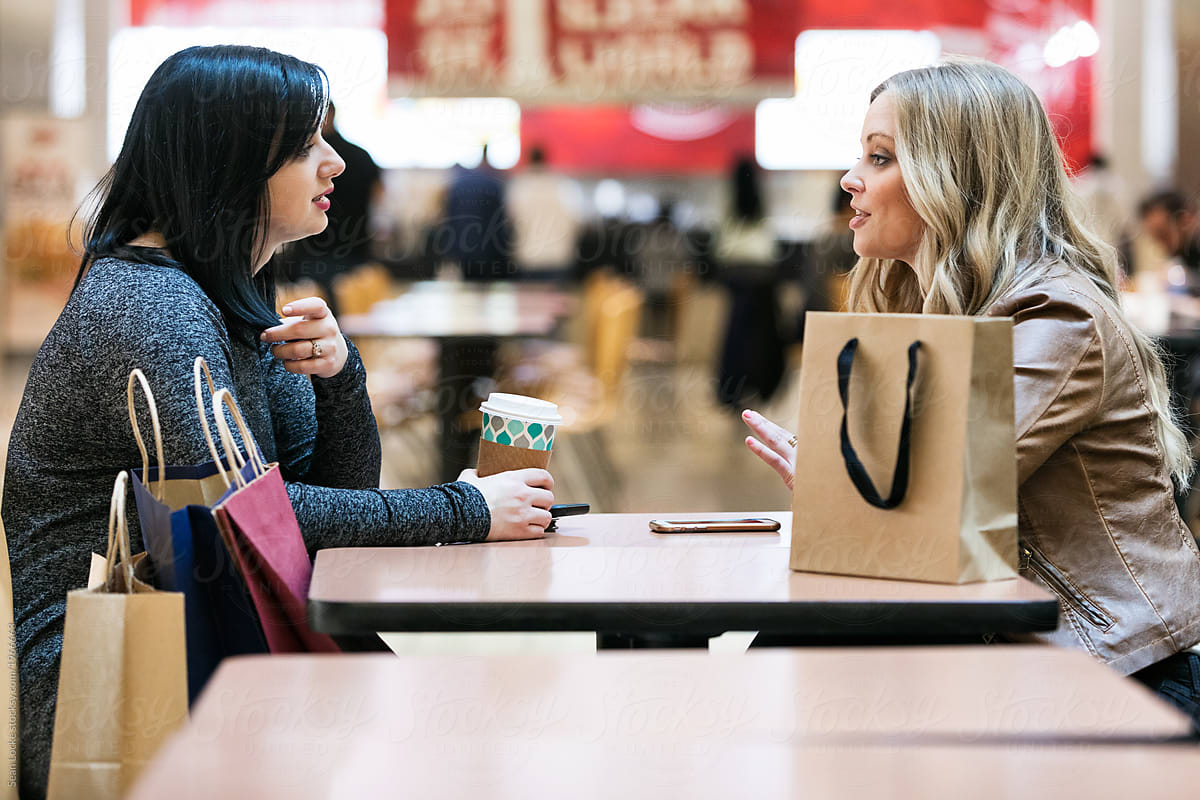Mall: Women Friends Relaxing In Food Court