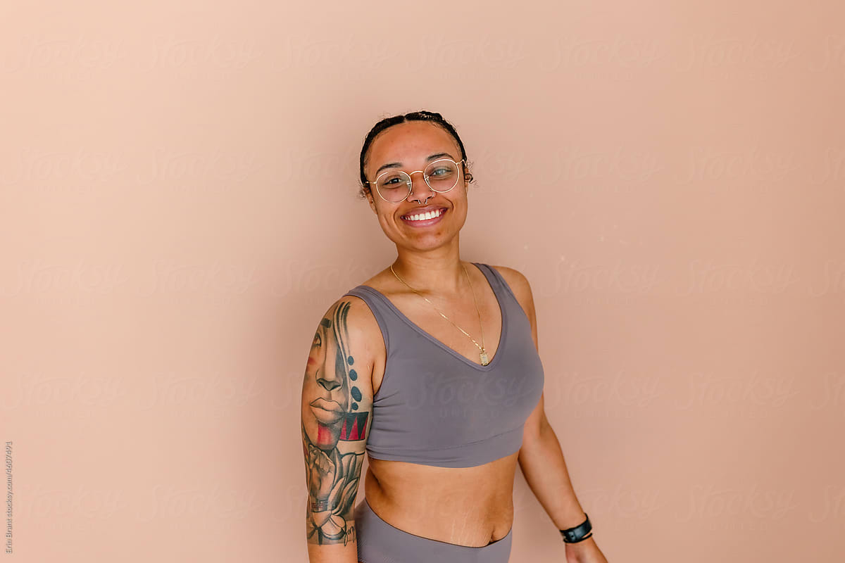 Mixed race woman with glasses in underwear