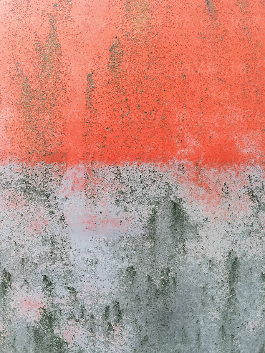 Close up of red and grey paint on old car door