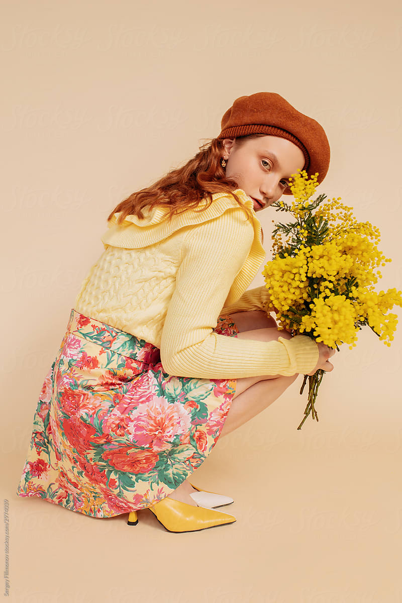 Fashion model posing with flowers