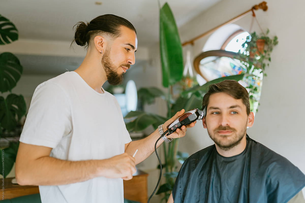 Barber clipping hair