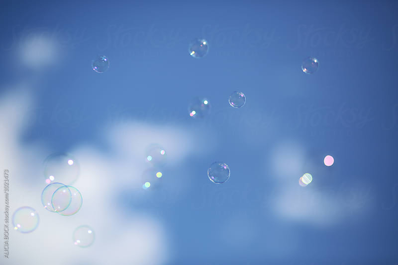 Bubbles Floating Against A Summer Sky