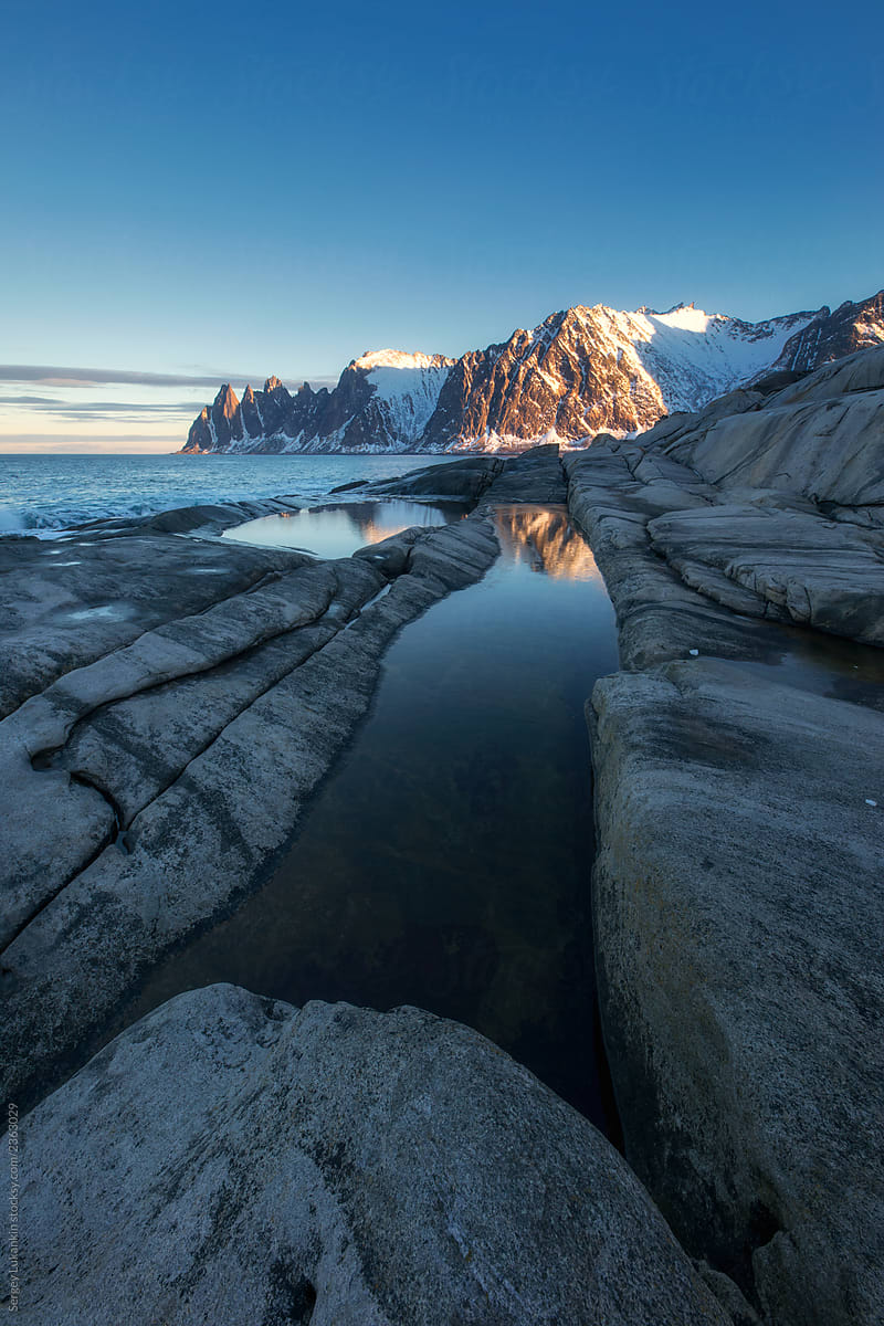 Winter Norwegian landscape with rocks and mountains