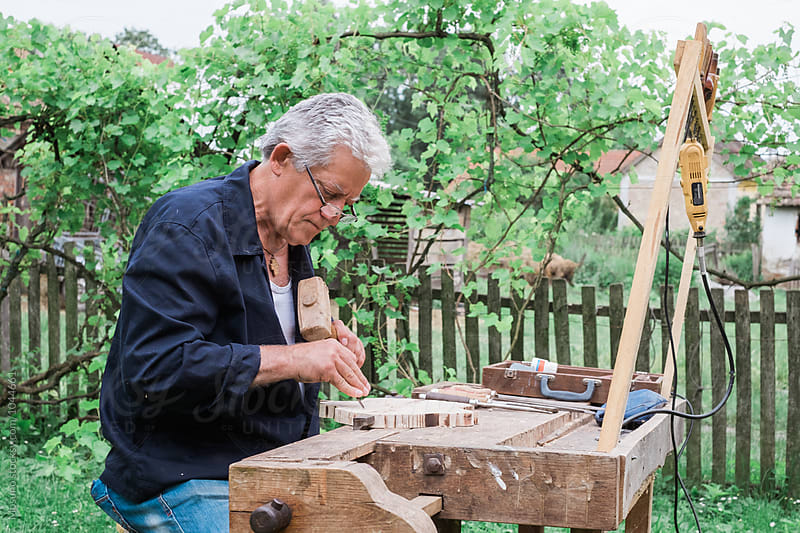 Senior Man Carving Wood
