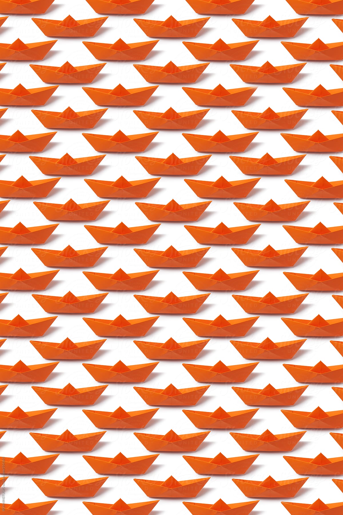 Orange origami boat pattern.