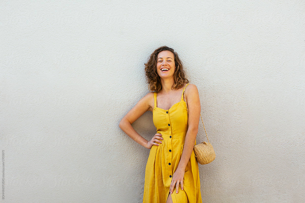 Beautiful woman wearing yellow dress. by BONNINSTUDIO - Dress, Spring -  Stocksy United