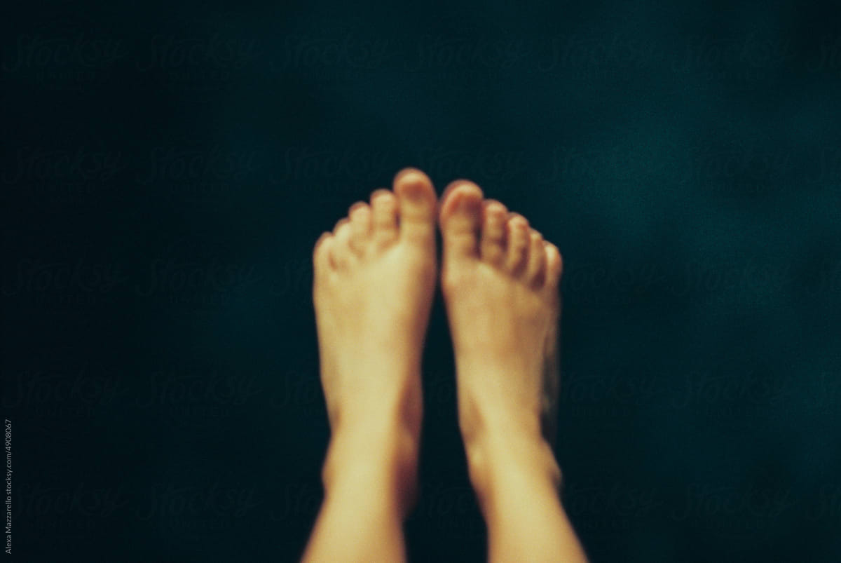 Blurry image of woman\'s feet in the air