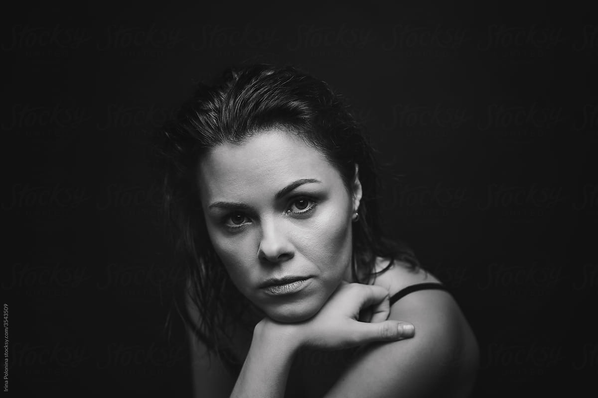 Black and white portrait of a pensive woman
