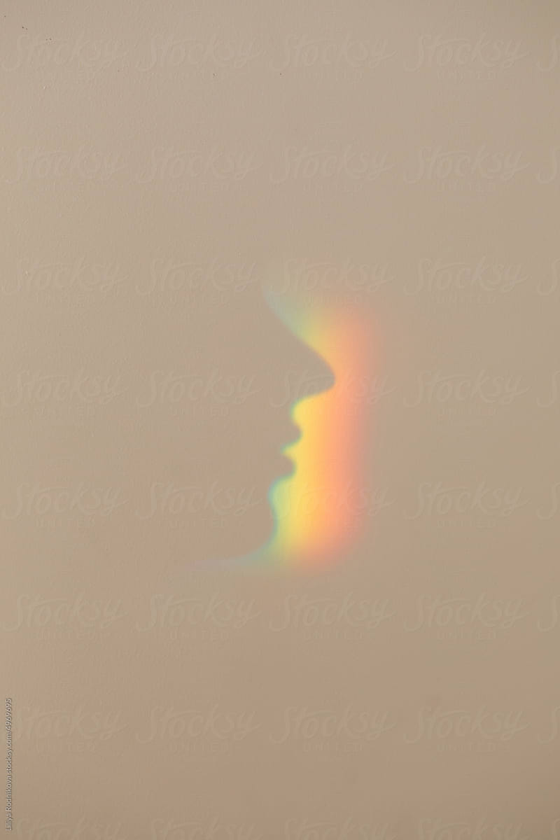 Rainbow profile of person on wall