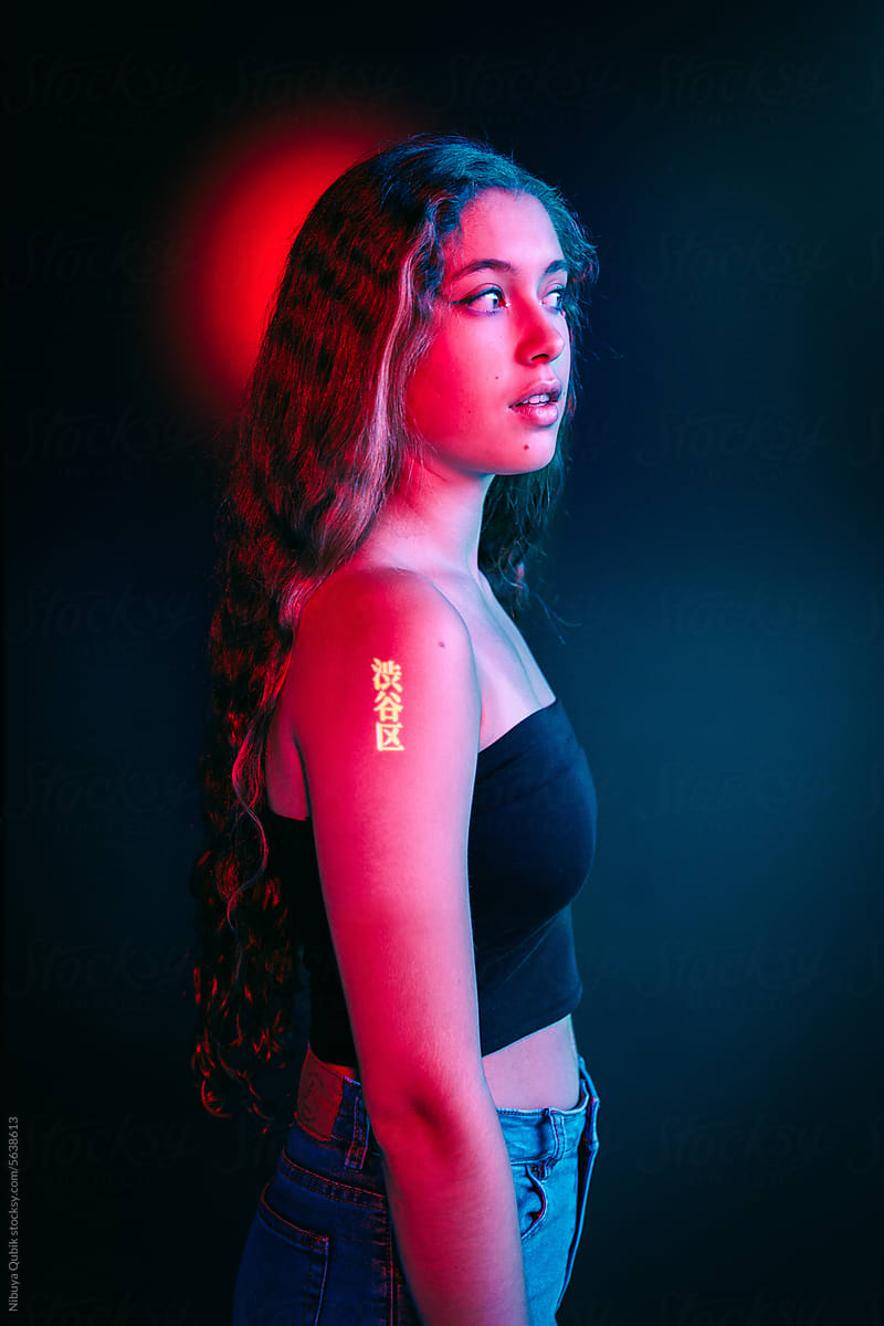 Futuristic creative studio portrait with neon lighting of stem woman