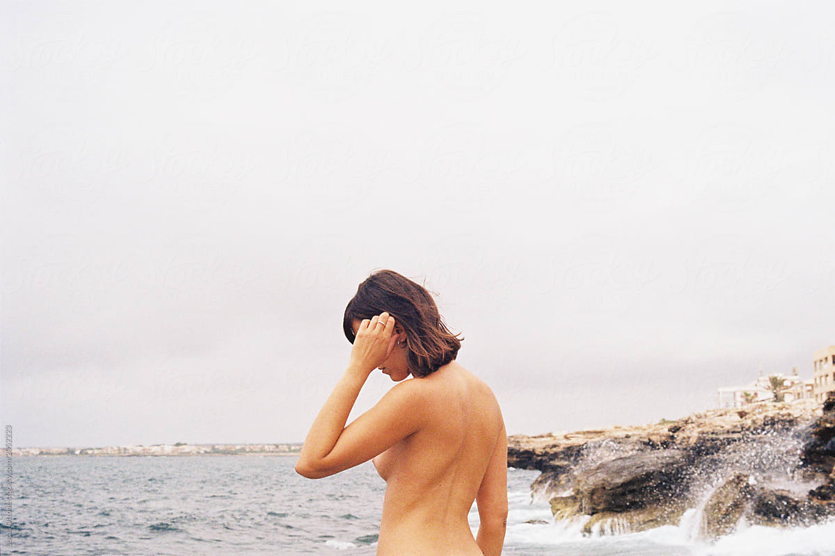 Topless Woman On The Seaside By Stocksy Contributor Lucas Ottone