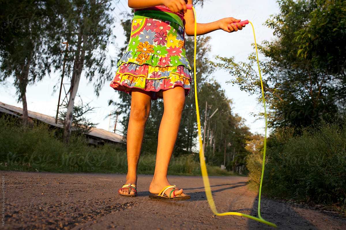 Teenage girl takes a break from plying with Jumping Rope