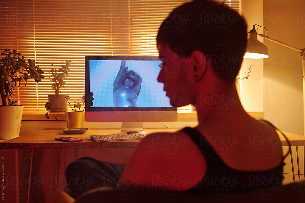 Young Man Watching Videos In Evening