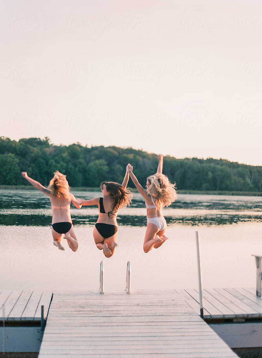 series of girlfriends running off a dock about to jump  into the lake