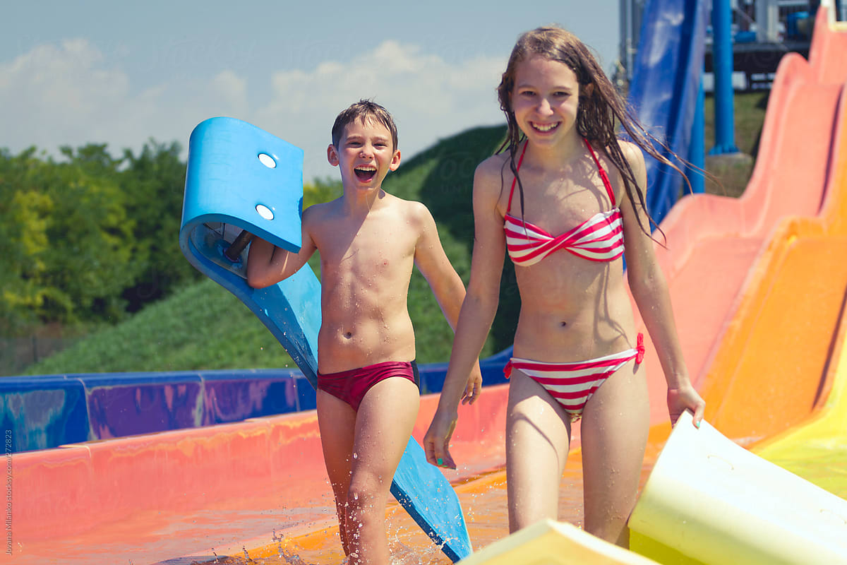 Download Boy And Girl In Bikini Having Fun In Water Park -2446