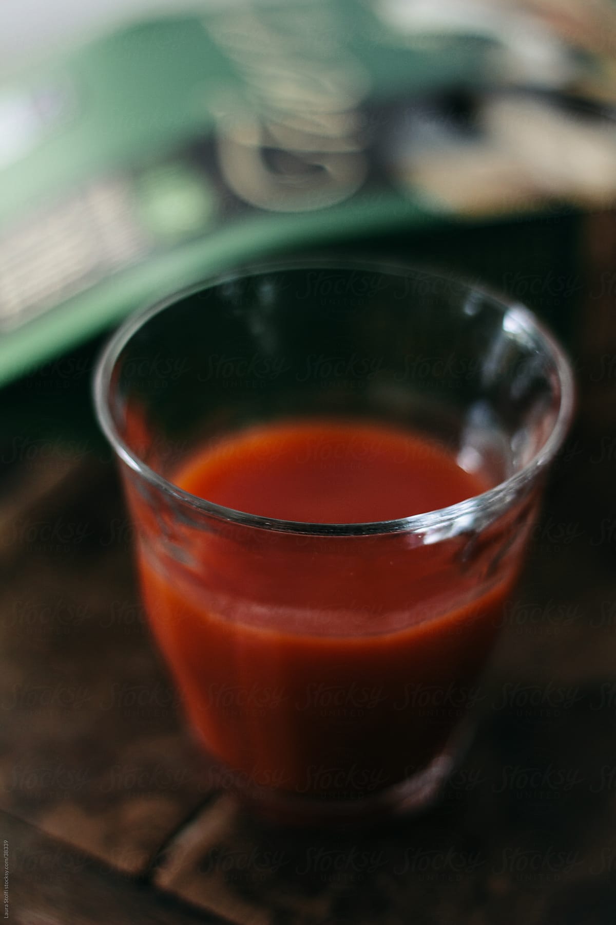 Close-up of tomato juice cocktail on wooden pub table
