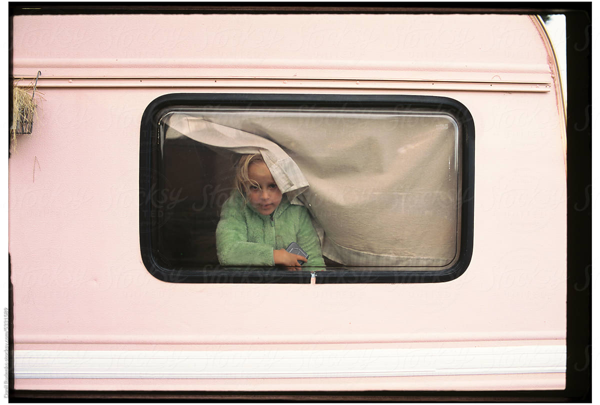 Girl gazing through the van window