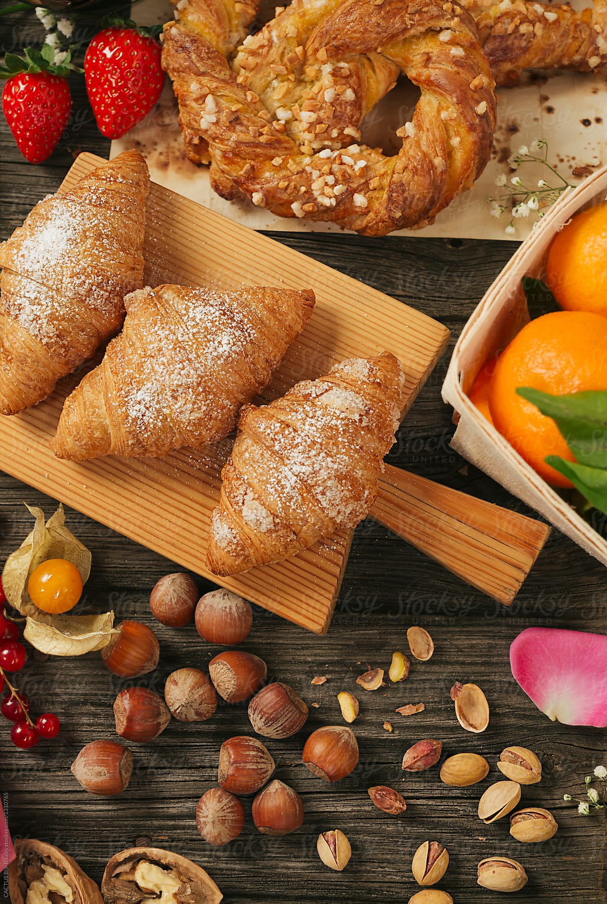 Breakfast. Croissants with fresh fruits and nuts