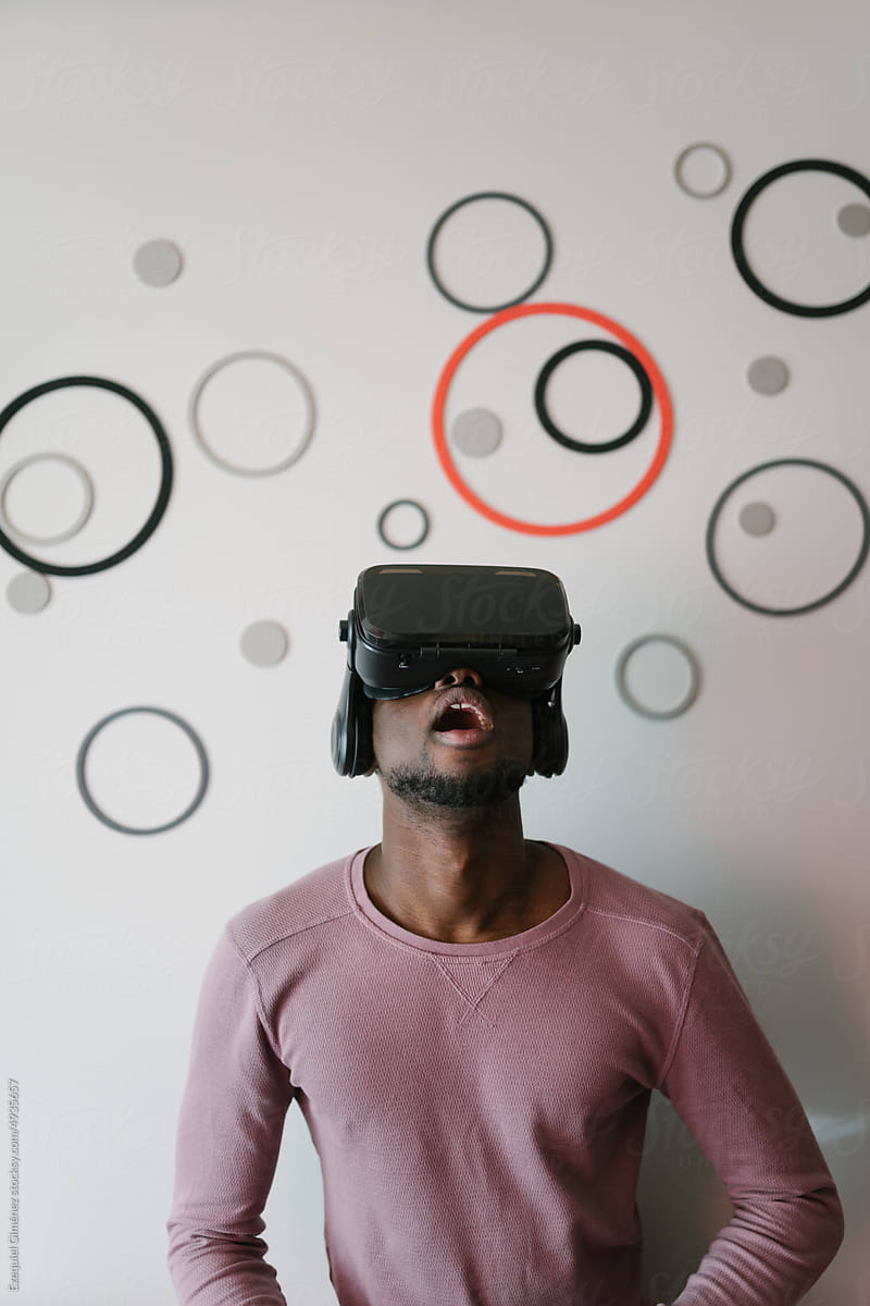 Shocked black man exploring virtual reality