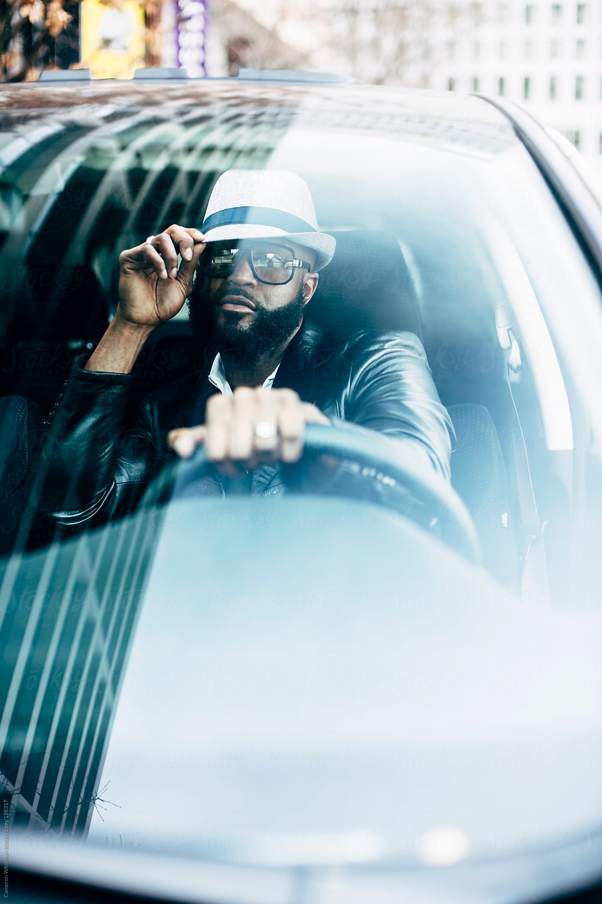 Stylish black man in his car