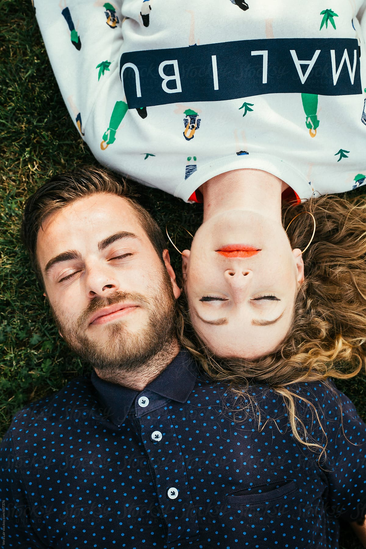 Young Couple Lying In The Grass By Stocksy Contributor Vera Lair Stocksy 