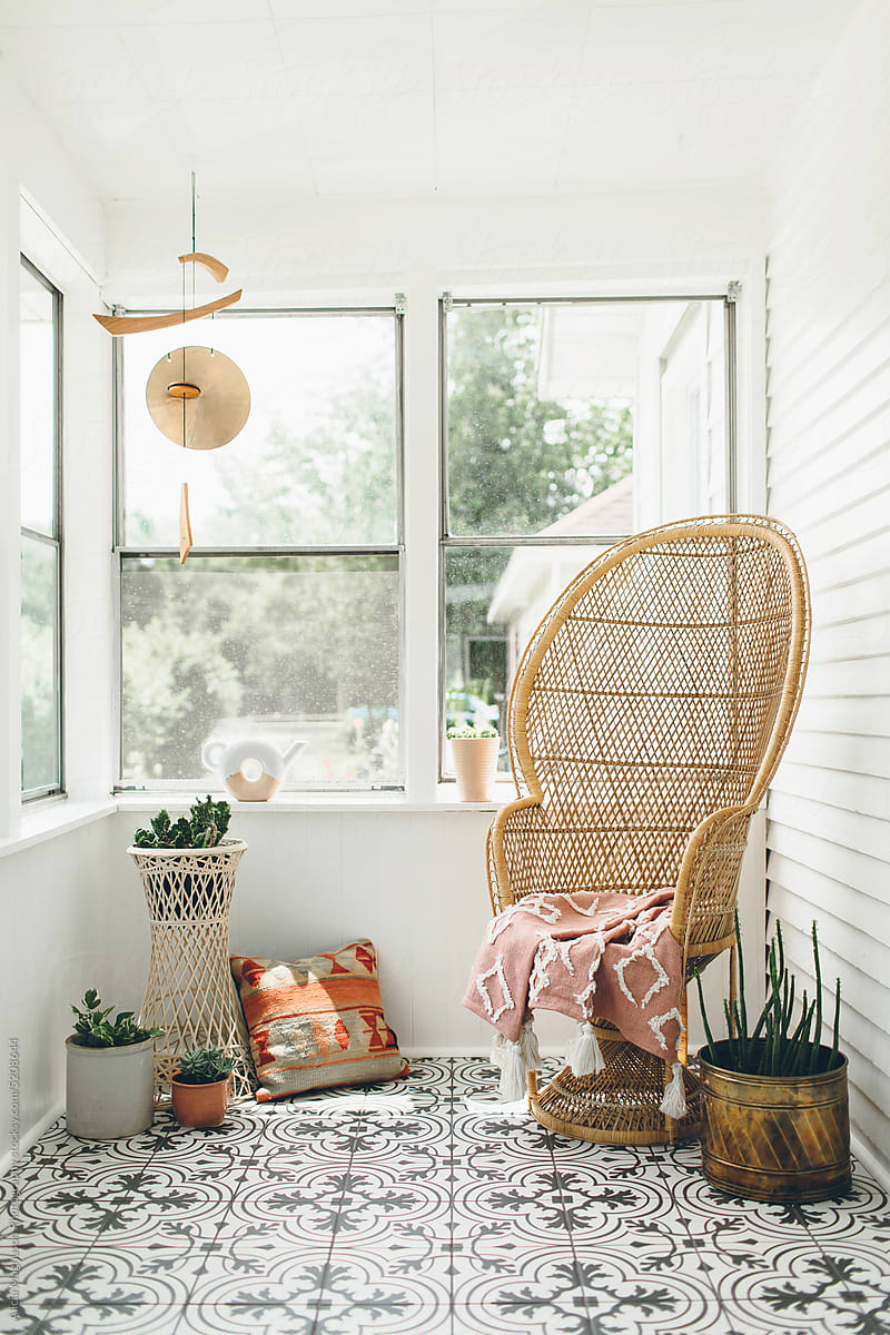 Boho Front Porch with Peacock Chair and Houseplants