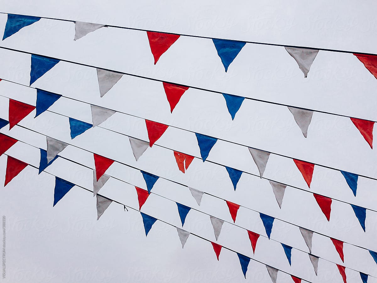 Small Triangular Flags in American Colors Hanging on Line