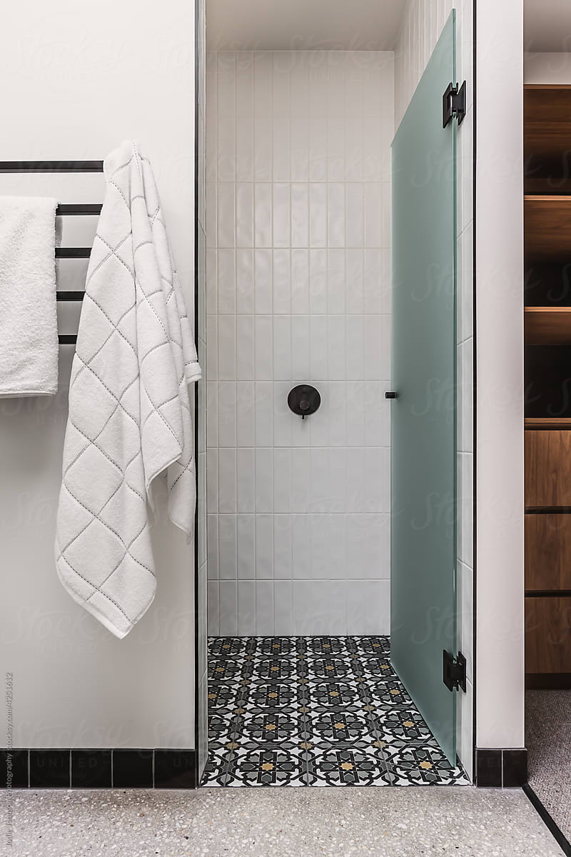 Bathroom shower with decorative floor tiles