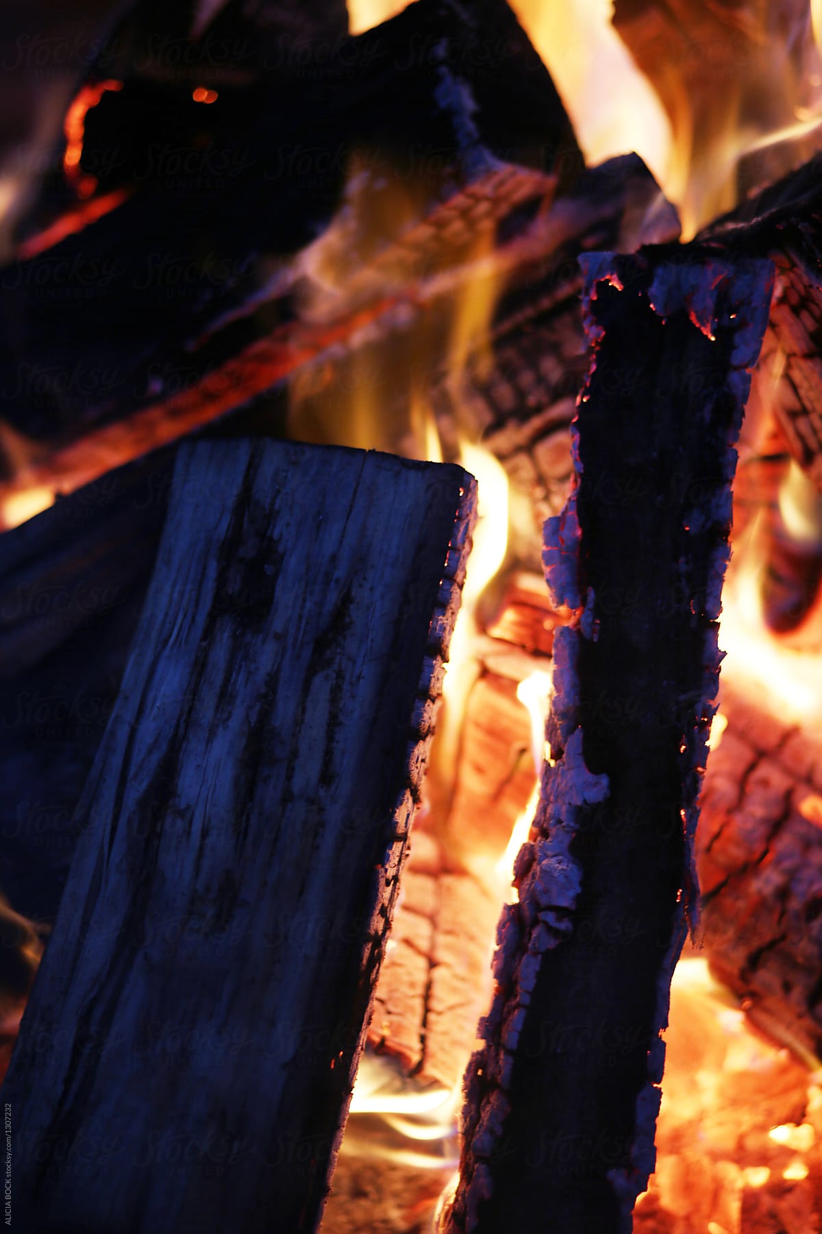 Close Up Of Hot Logs And Coals In A Winter Fire
