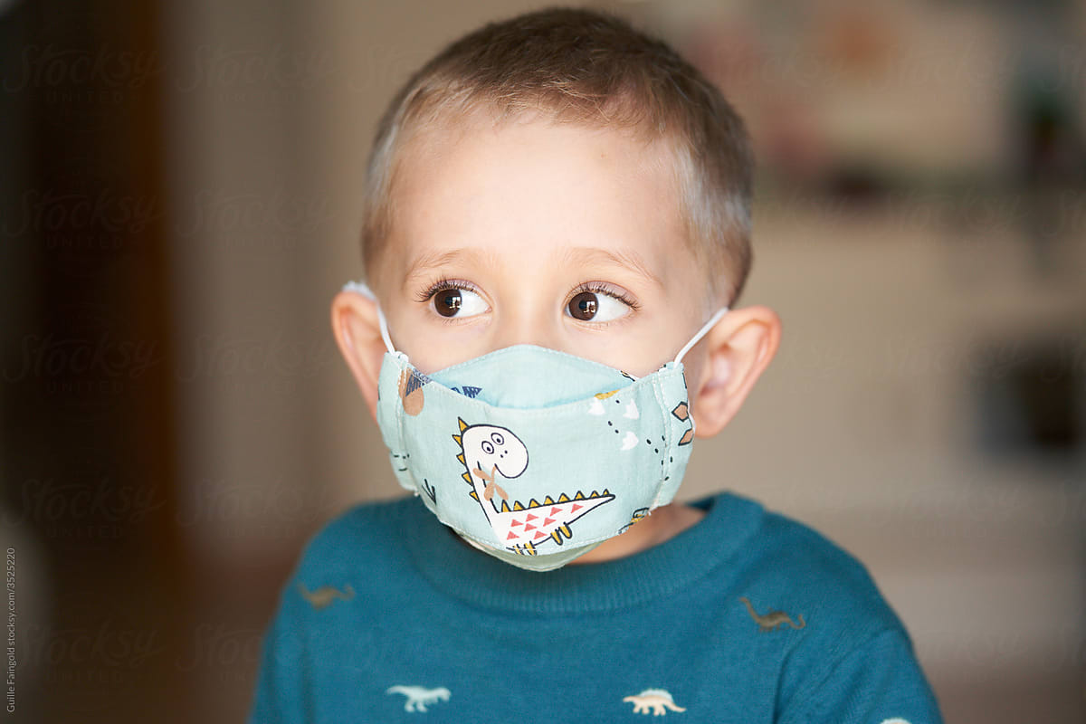 Adorable boy in protective mask