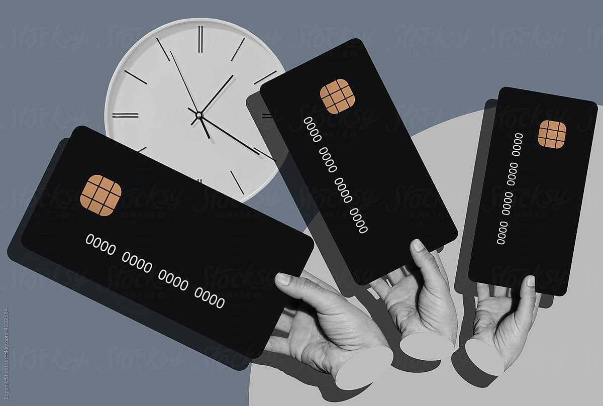 Male Hands Holds A Credit Cards And Clock