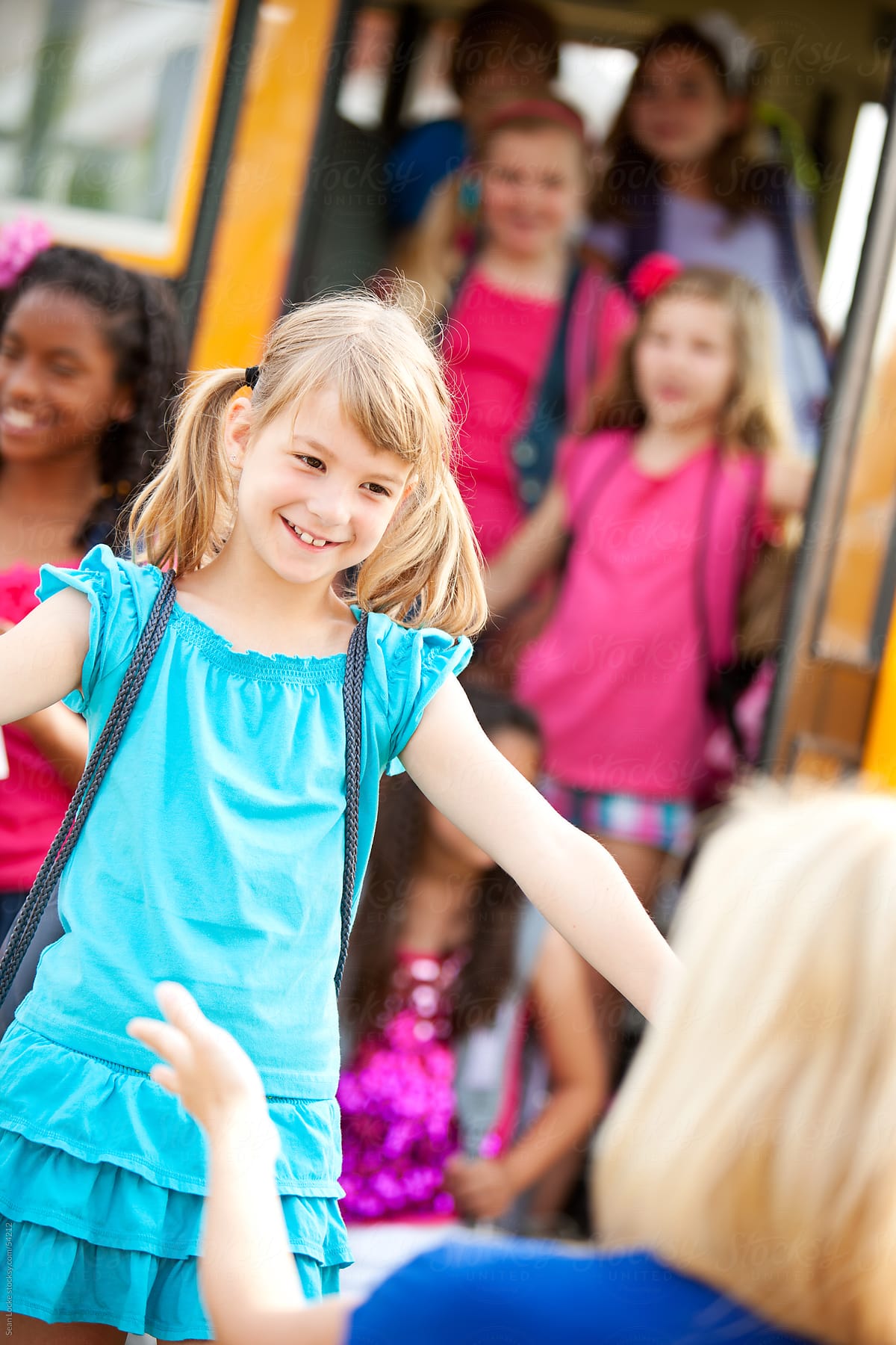 School Bus: Girl Ready to Hug Mother