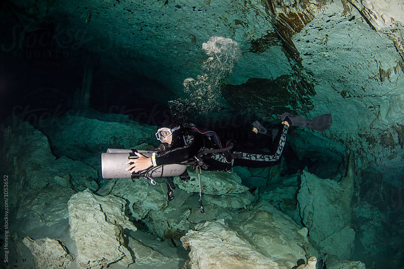 A scuba diver swimming in Mexico's  Cenote  Dos Ojos