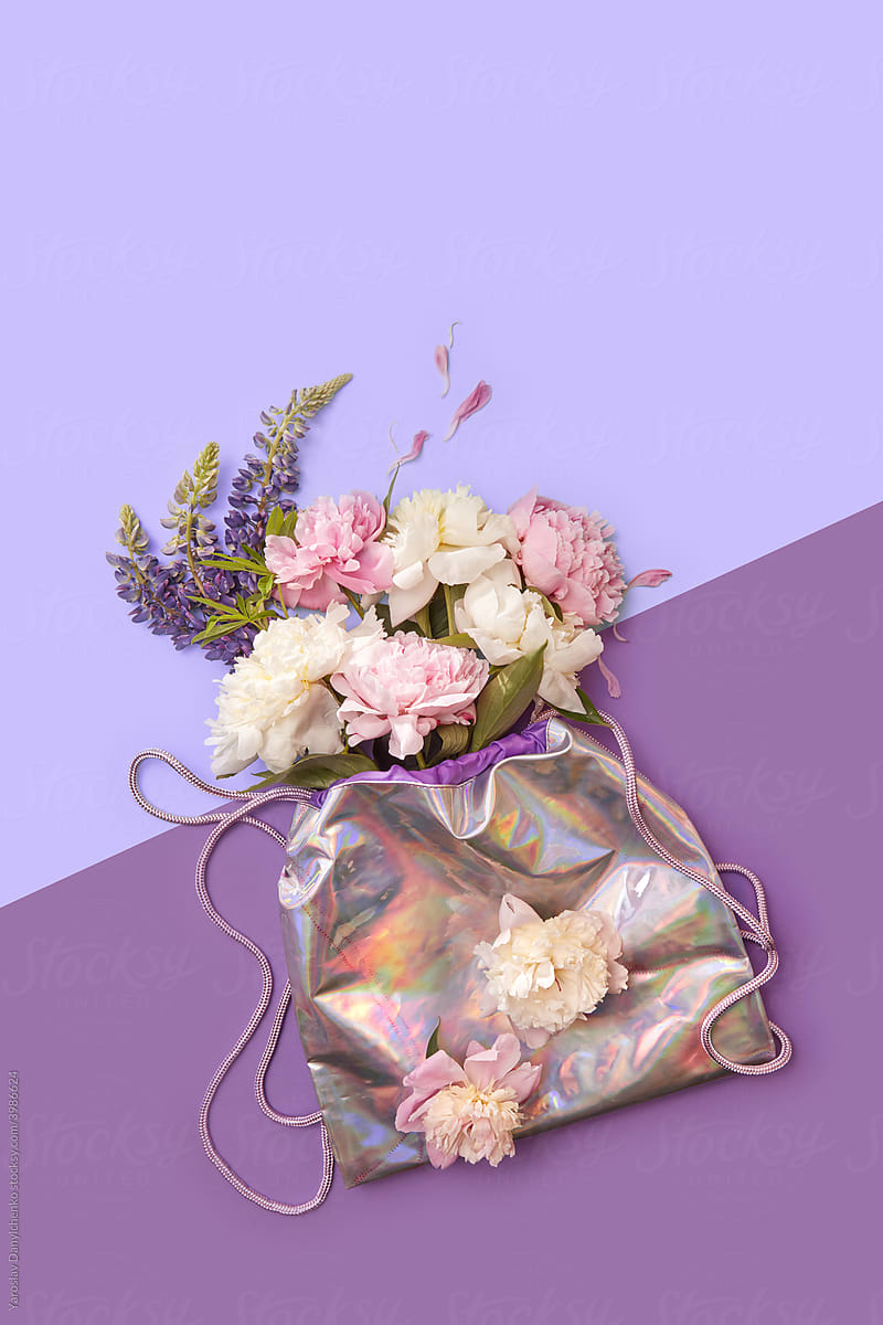 Bouquet of peonies in holographic foil bag