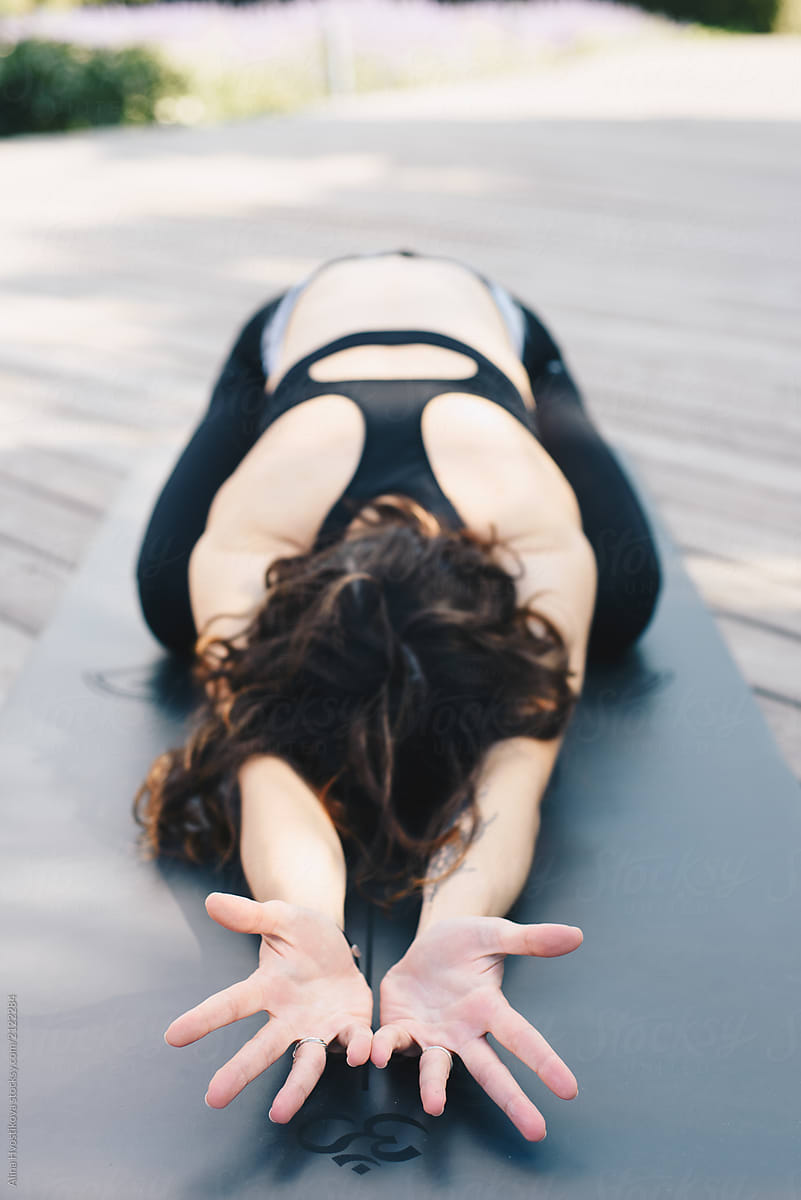 Anonymous Woman Stretching On Mat By Stocksy Contributor Alina