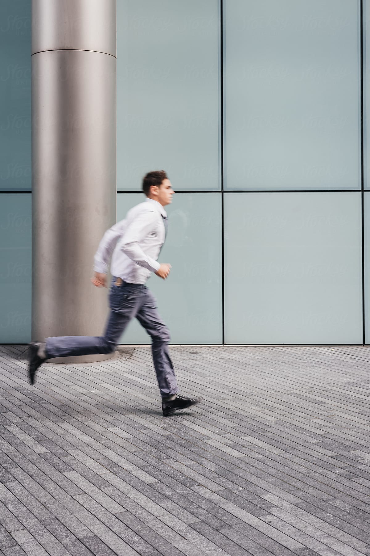 A businessman runs fast to the office
