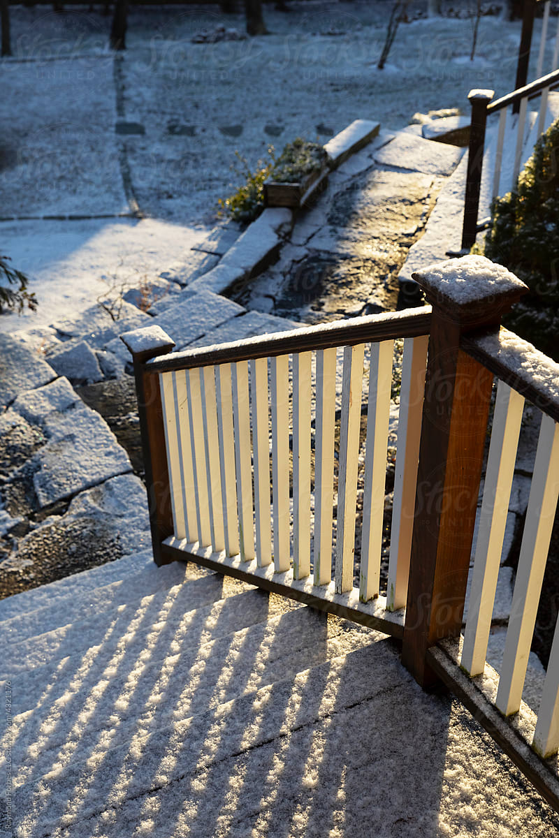 Light Dusting of snow on Stairway Railing to home