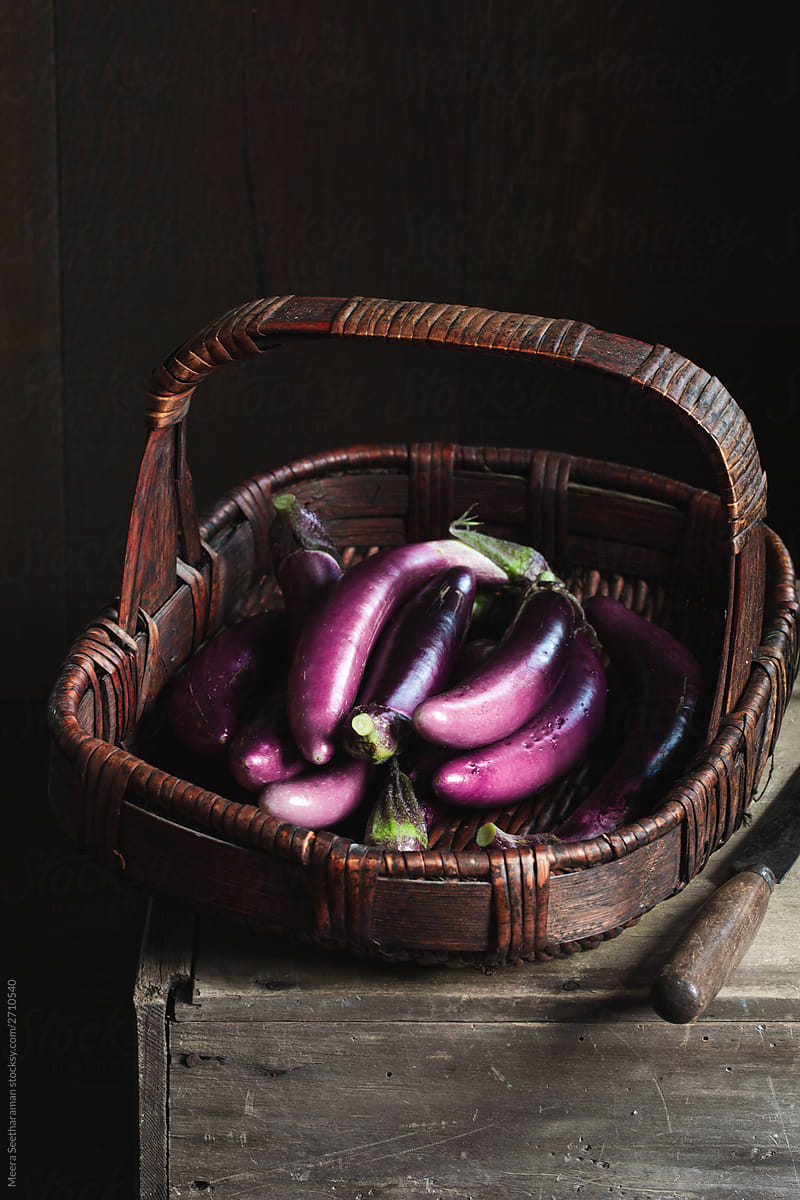 Farm fresh eggplants in a vintage brown basket